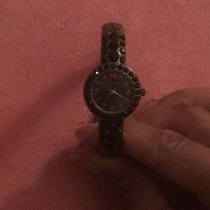 Very “antique” black bangle watch.